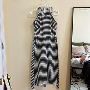 High neck, wide leg jumpsuit! Tie at the waist, very flattering. Never worn! S-M